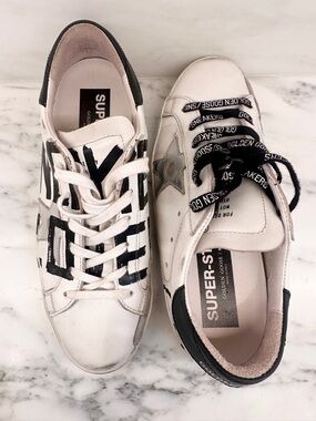 Golden Goose White Leather Low-Top Sneakers with Black Graphic Accents. LOVE🤍